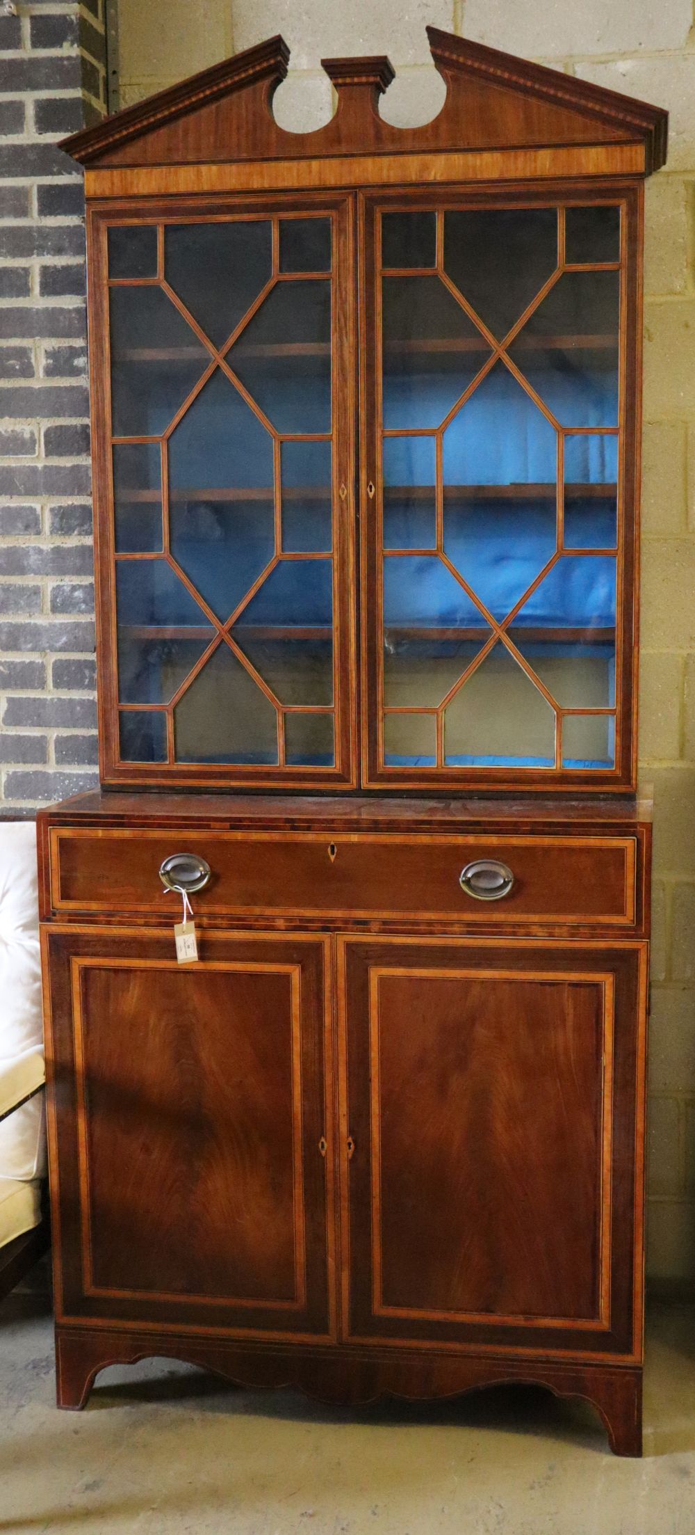 A George III and later mahogany, satinwood banded bookcase cabinet, W.107cm, D.51cm, H.246cm